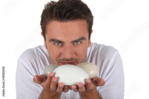 Photo: Man smelling bars of soap Man smelling bars of soap