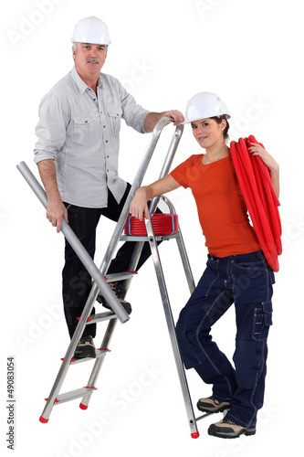Photo: Two electrician installing wiring Two electrician installing wiring