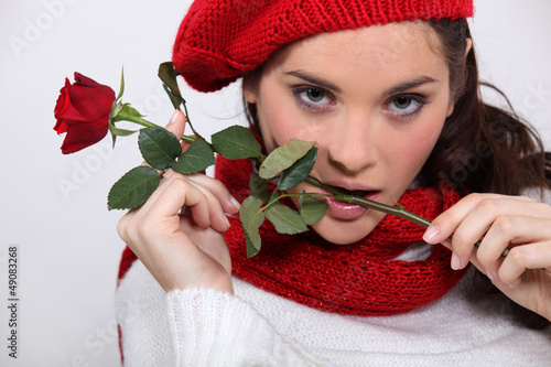 Photo: Brunette with rose in her mouth Brunette with rose in her mouth