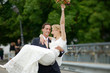 Groom carrying his bride