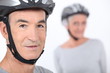 Senior man with a bicycle helmet