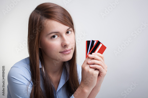 Photo: Young woman with credit cards Young woman with credit cards