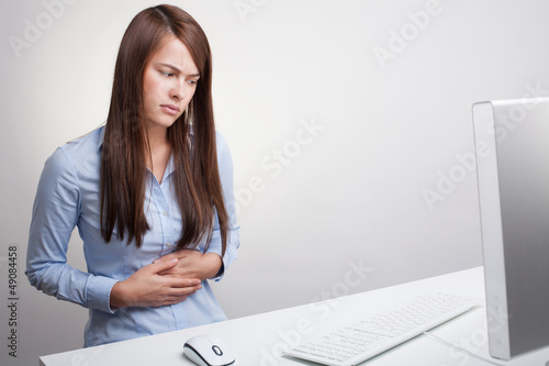 Photo: Woman massaging pain Woman massaging pain