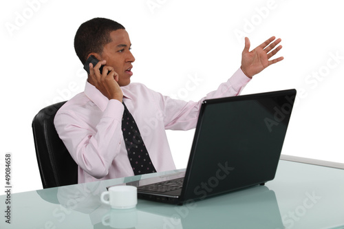 Photo: Businessman at his desk Businessman at his desk