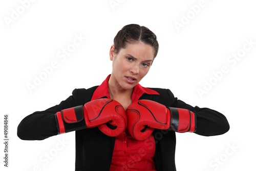 Photo: Woman getting her boxing gloves ready Woman getting her boxing gloves ready