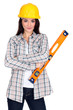 pretty female carpenter posing with ruler