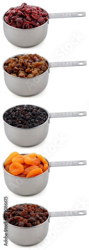 Photo: A variety of dried fruit in cup measures A variety of dried fruit in cup measures