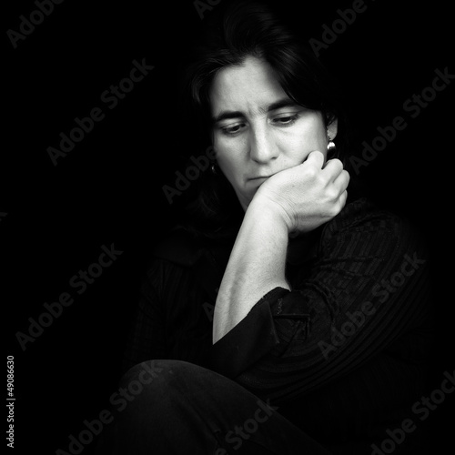 Photo: Black and white portrait of a beautiful and sad hispanic woman Black and white portrait of a beautiful and sad hispanic woman