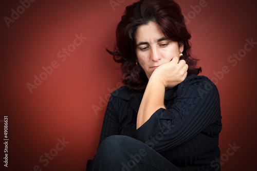 Photo: Beautiful hispanic woman with a very sad expression Beautiful hispanic woman with a very sad expression
