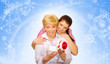 Young woman with her mother on winter background