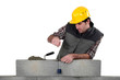 Tradesman using a plumb-bob
