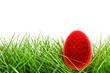 Golf easter egg in the grass - isolated over white