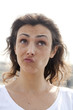 Photo: young woman thinking out loud young woman thinking out loud