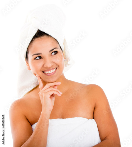 Photo: Thoughtful woman in towel Thoughtful woman in towel