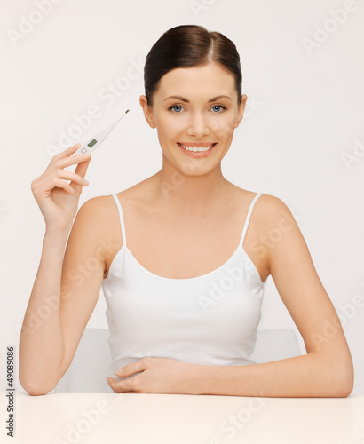 Photo: woman with thermometer woman with thermometer