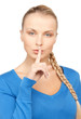 picture of woman with finger on lips