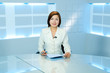 television anchorwoman at TV studio