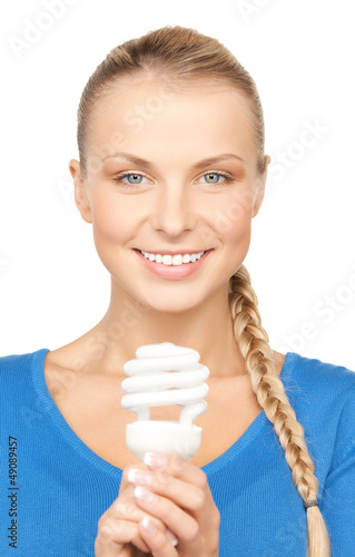 Photo: woman with energy saving bulb woman with energy saving bulb