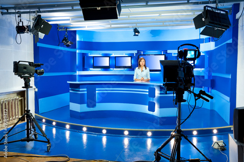 Photo: television newscaster at TV studio television newscaster at TV studio