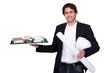 Architect holding scale model of housing