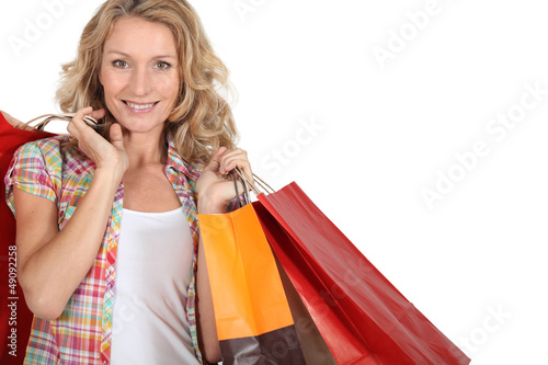 Photo: Woman with numerous shopping bags Woman with numerous shopping bags