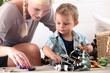 Foto: Mother playing with her little boy Mother playing with her little boy