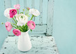 White and pink flowers on light blue chair