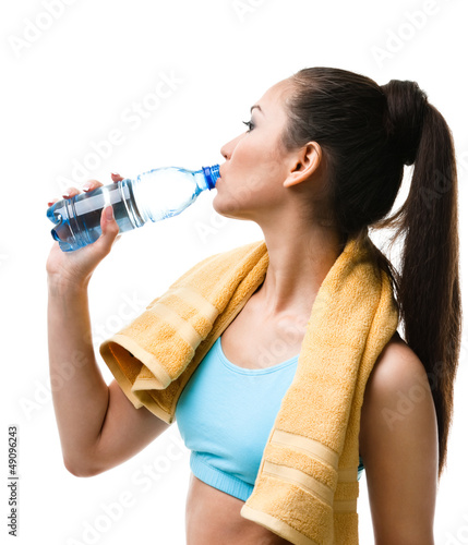 Photo: Athletic woman with yellow towel on the shoulders Athletic woman with yellow towel on the shoulders