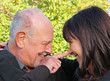 Elderly father and daughter laughing and joking