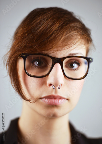 Photo: Piercing and Nerd Glasses on Woman Piercing and Nerd Glasses on Woman