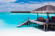 Over water jetty with steps into tropical lagoon