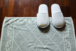 White slippers on doormat
