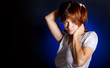 A thoughtful woman in studio