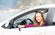 Woman with keys of new rental car