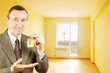 Man shows keys with keychain into a new flat