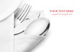 Knife, fork and spoon with linen serviette.