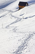 Snow path leading to an alpine hut at Pordoi pass