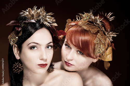Photo: Beautiful Portrait of two womans with luxurious hair style Beautiful Portrait of two womans with luxurious hair style