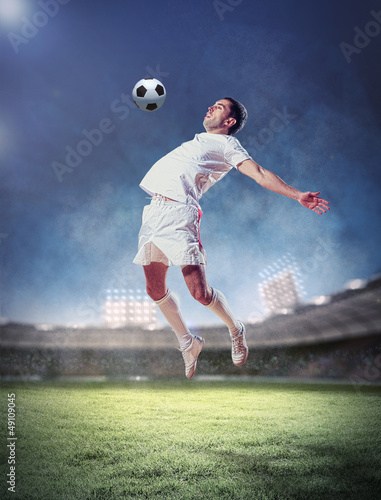 Photo: football player striking the ball football player striking the ball