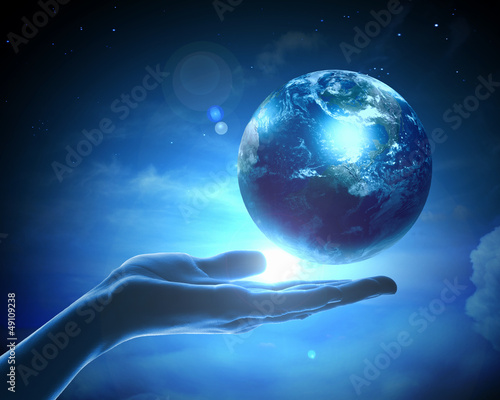 Photo: Image of earth planet on hand Image of earth planet on hand