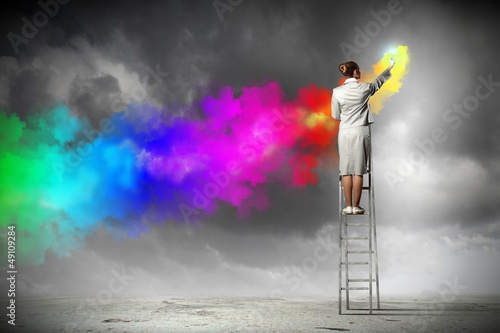 Photo: Young woman drawing splashes Young woman drawing splashes