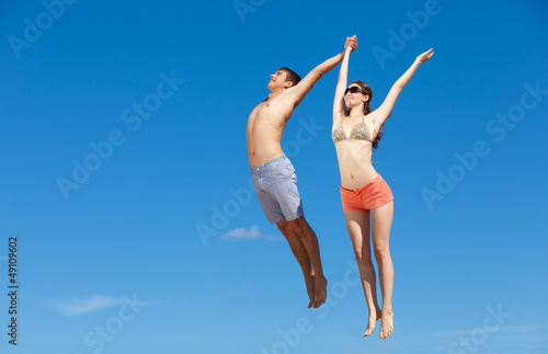 Photo: Happy Young Couple Together On The Beach Happy Young Couple Together On The Beach