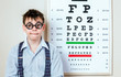 Photo: person wearing spectacles in an office at the doctor person wearing spectacles in an office at the doctor