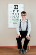 Foto: person wearing spectacles in an office at the doctor person wearing spectacles in an office at the doctor