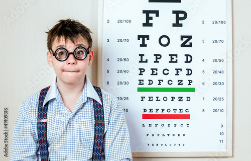 Photo: person wearing spectacles in an office at the doctor person wearing spectacles in an office at the doctor