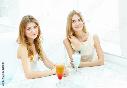 Photo: Young woman with a glass of drink Young woman with a glass of drink