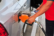Man's hand holding a gas pump