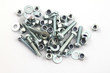 Photo: Nut and bolts on a white background. Nut and bolts on a white background.