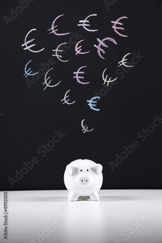 Photo: Piggybank and the Euro currency Piggybank and the Euro currency