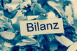 Papierschnitzel Stichwort Bilanz